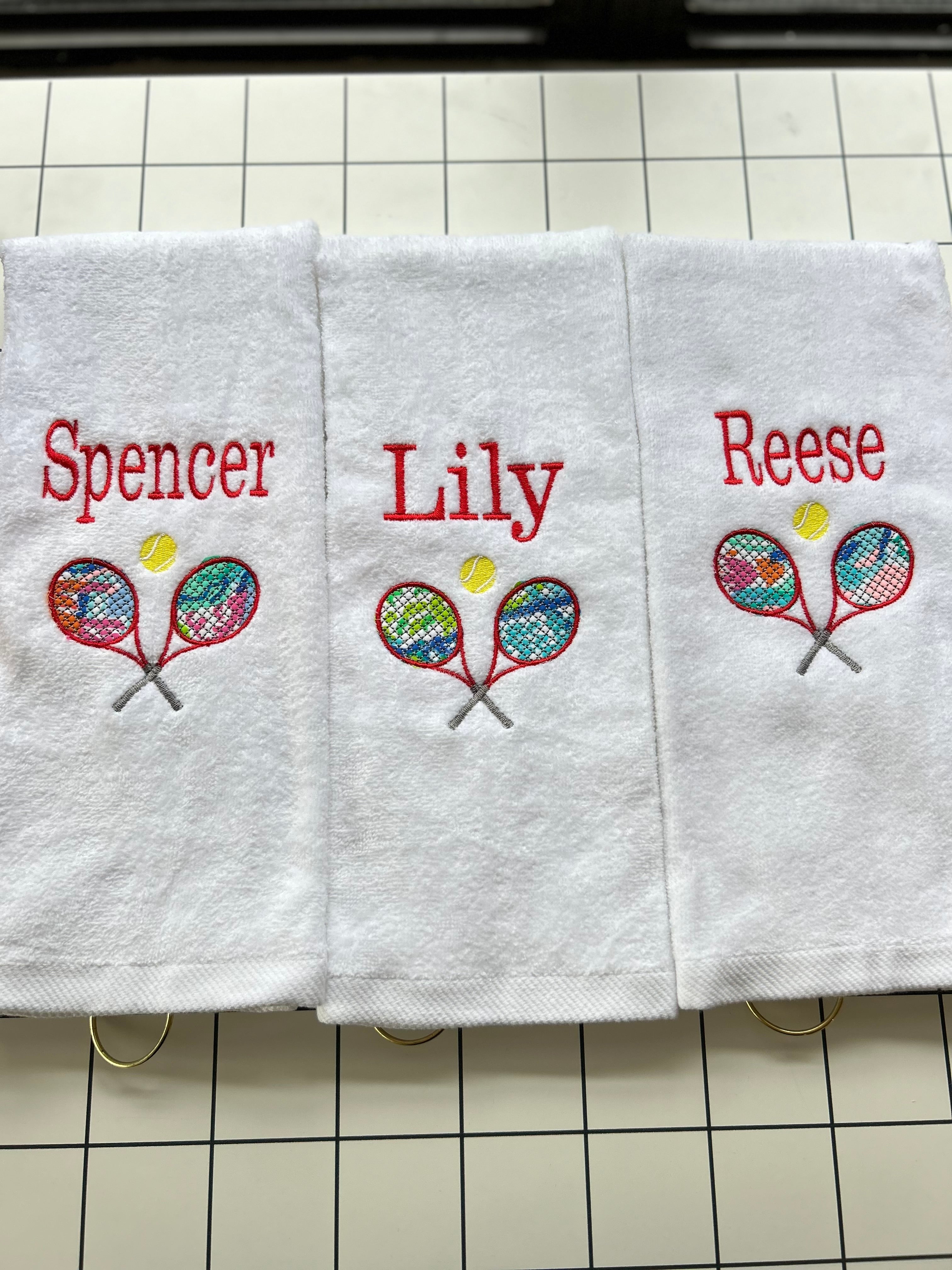 Tennis towel with grommet